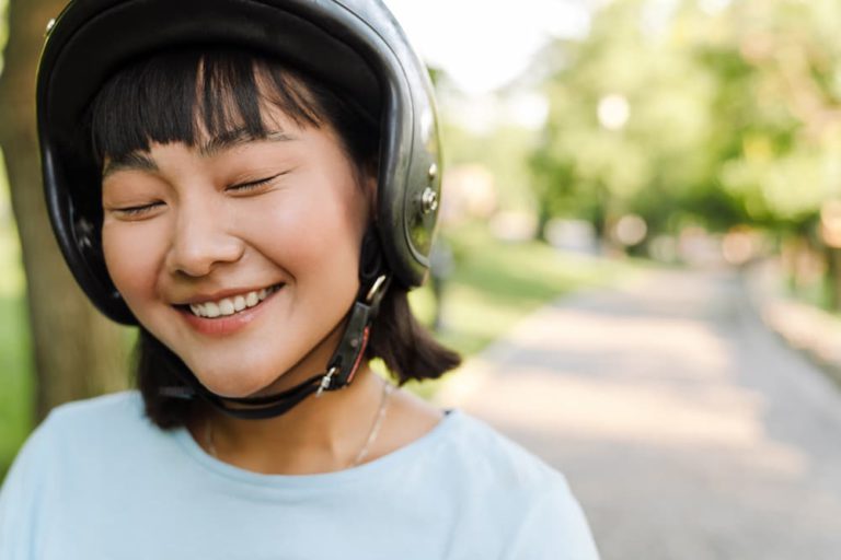 close up of a smiling young asian woman 2021 12 09 19 47 14 utc 1