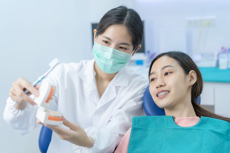 asian woman listening dentist explaining about tee 2021 12 09 21 04 06 utc 1